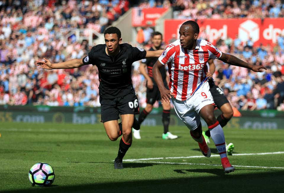 <p>Liverpool’s Trent Alexander-Arnold (left) and Stoke City’s Saido Berahino battle for the ball</p>