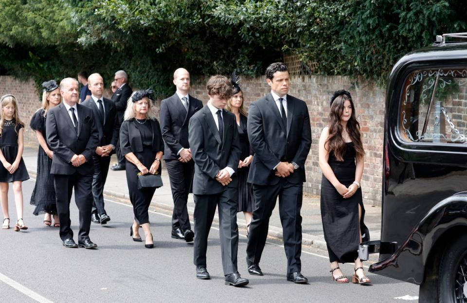 Hugo Bowen, Sebastien Bowen and Eloise Bowen lead the procession with (L-R second row) parents Alistair James, Heather James and brother Ben James during the funeral of Dame Deborah James at St Mary's Church (Getty Images)