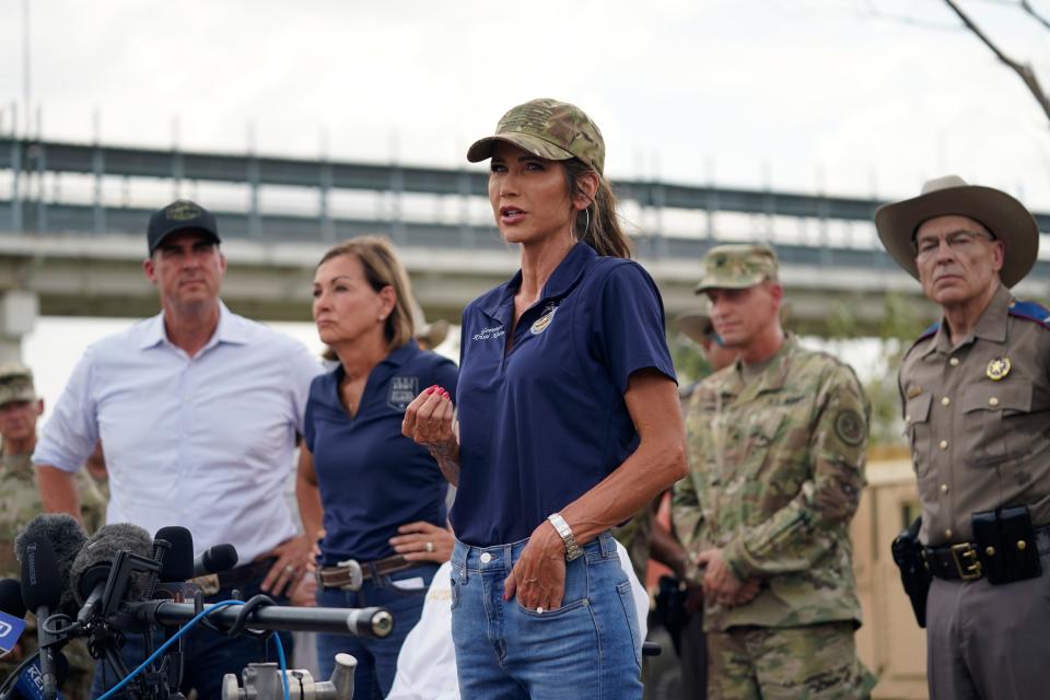 South Dakota Gov. Kristi Noem, center, is joined by other Republican governors as she speaks during a news conference along the Rio Grande, Monday, Aug. 21, 2023, in Eagle Pass, Texas.