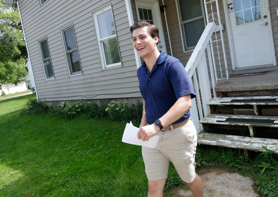 Joey Van Deurzen goes door to door looking for potential votes Aug. 29, 2022, in Kaukauna, Wis. Van Deurzen is the Democratic candidate for the 5th Assembly District.