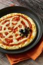<p>Serve up a piping hot slice of spookiness with these super-simple pizzas made with pre-baked crust, pizza sauce, strategically placed string cheese and a black olive spider.</p><p><a rel="nofollow noopener" href="https://www.womansday.com/food-recipes/food-drinks/recipes/a10838/spiderweb-pizzas-recipe-122166/" target="_blank" data-ylk="slk:Get the recipe.;elm:context_link;itc:0;sec:content-canvas" class="link "><strong>Get the recipe.</strong></a></p>