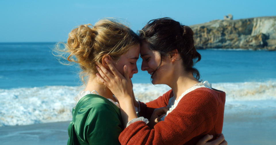 This image released by Neon shows Adèle Haenel, left, and Noémie Merlant in a scene from "Portrait of a Lady on Fire." (Neon via AP)