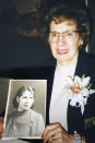 This 1997 photo provided by the family shows Phyllis Antonetz on her 80th birthday, holding her Julia Richman High School graduation picture in New York. She died of COVID-19 at 103 on April 17, 2020. (Family photo via AP)