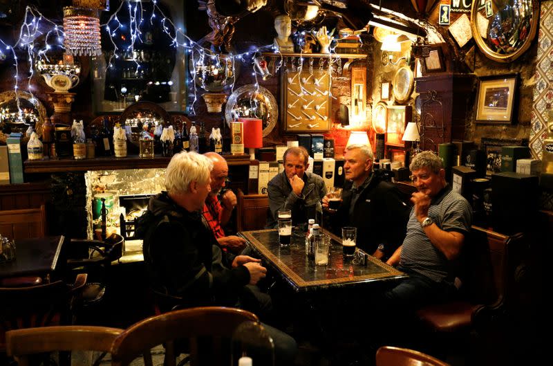 FILE PHOTO: Patrons have a drink at Dirty Dick's pub in Edinburgh