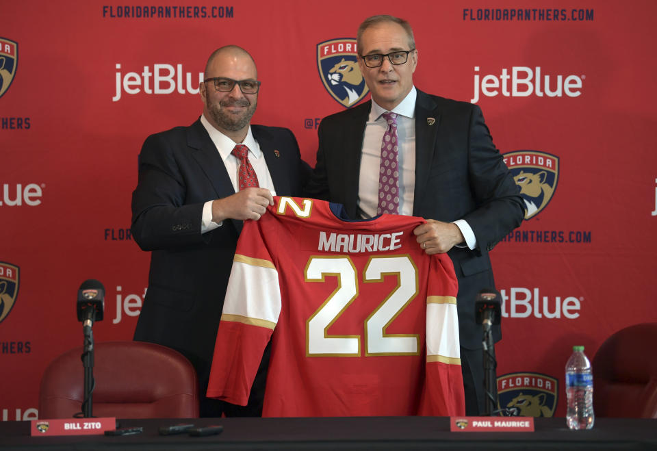 Paul Maurice, right, is introduced as the new head coach of the Florida Panthers by general manager Bill Zito, during an NHL hockey news conference at FLA Live Arena, Friday, June 23, 2022, in Sunrise, Fla. (AP Photo/Jim Rassol)