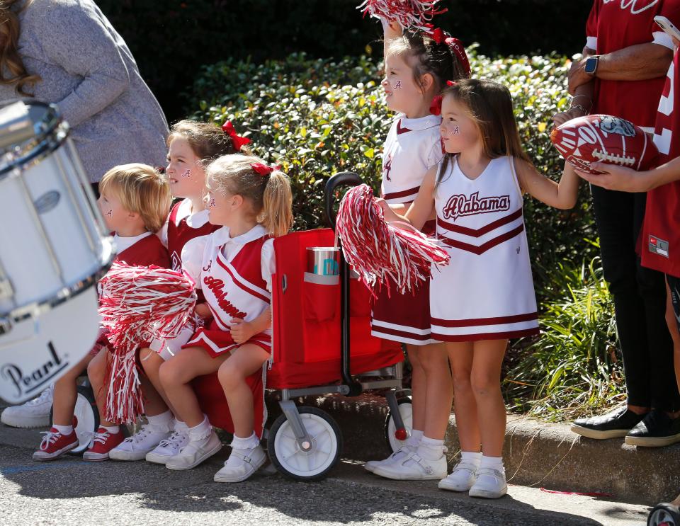 Young fans watch during the University of Alabama homecoming parade in downtown Tuscaloosa Saturday, Oct. 23, 2021. [Staff Photo/Gary Cosby Jr.]