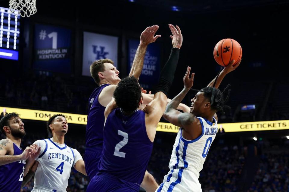 Kentucky guard Rob Dillingham (0) shoots the ball against Stonehill forward Max Zegarowski (2) during Friday’s game at Rupp Arena.