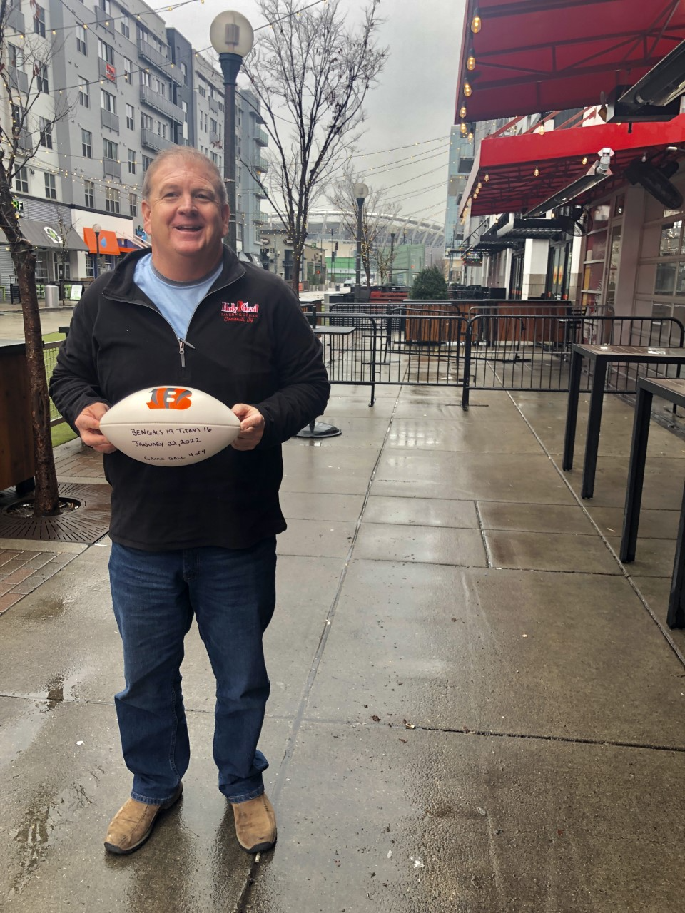 Jim Moehring, owner of the Holy Grail in Cincinnati, shows the game ball presented to him by the Bengals.