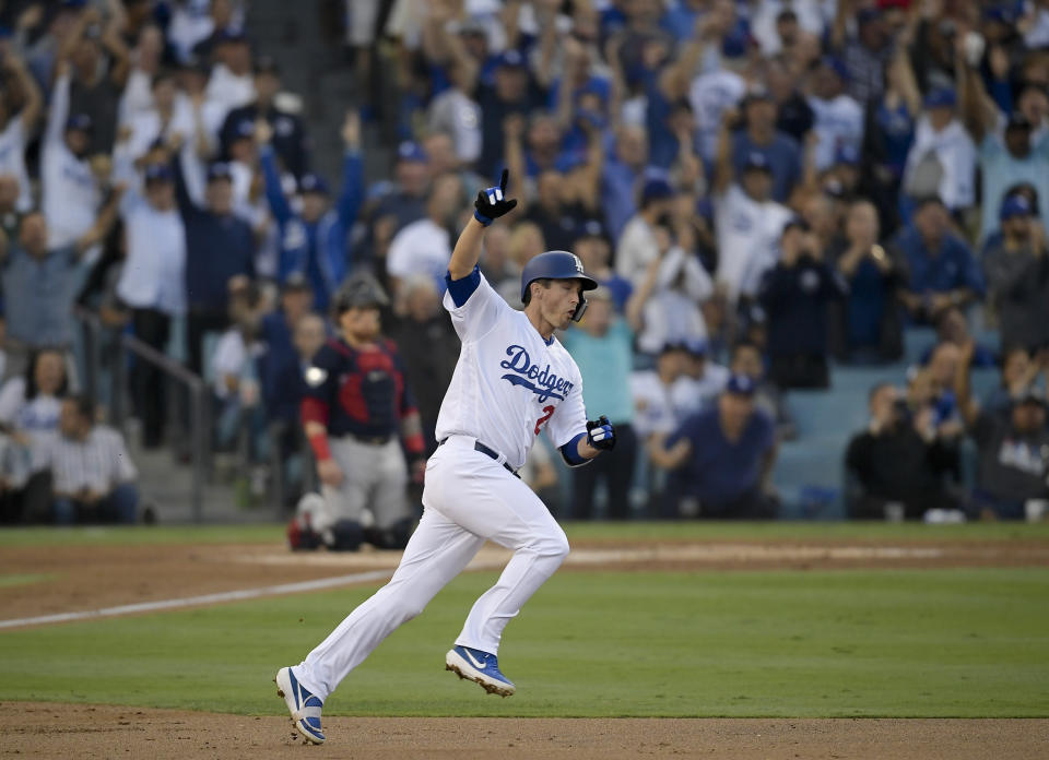 FILE - In this Oct. 28, 2018, file photo, Los Angeles Dodgers' David Freese celebrates after his home run against the Boston Red Sox during the first inning in Game 5 of the World Series baseball game in Los Angeles. Freese is retiring after a 10-year career that included a World Series title in 2011 with the St. Louis Cardinals when he was MVP. The 36-year-old infielder made the announcement Saturday, Oct. 12, 2019, on his verified Twitter account. (AP Photo/Mark J. Terrill, File)