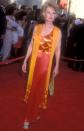 <p>The screen queen made a memorable entrance on the 1989 Academy Awards red carpet in this fiery red-and-orange number. </p>