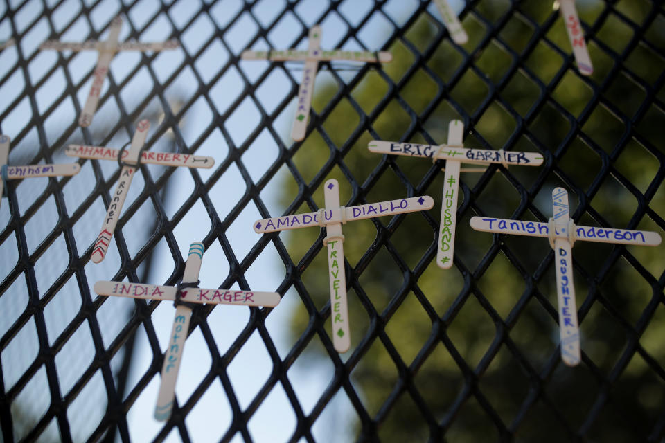 Image: Crosses on White House fence (Maya Alleruzzo / AP)
