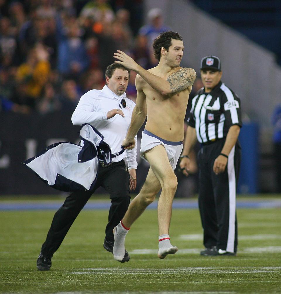 TORONTO, ON - DECEMBER 16: A streaker runs across the field during a timeout in play between the Buffalo Bills and Seattle Seahawks at Rogers Centre on December 16, 2012 in Toronto, Ontario.Seattle won 50-17. (Photo by Rick Stewart/Getty Images)