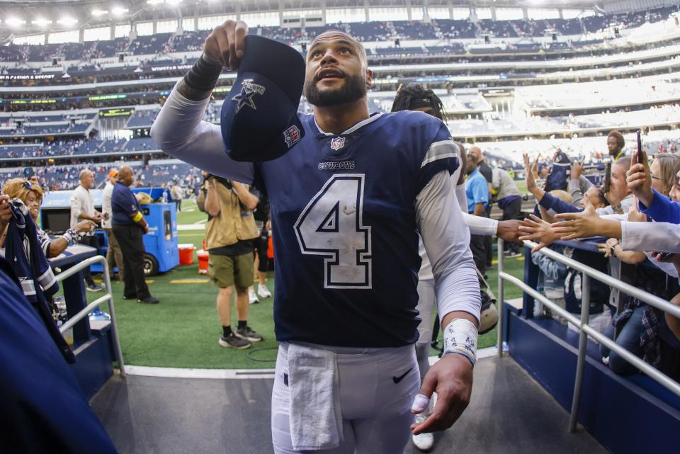 Dallas Cowboys' Dak Prescott walks off the field after an NFL football game against the Chicago Bears Sunday, Oct. 30, 2022, in Arlington, Texas. The Cowboys won 49-29. (AP Photo/Ron Jenkins)