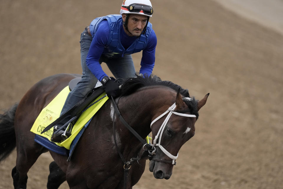 Kentucky Derby hopeful Catching Freedom works out at Churchill Downs Tuesday, April 30, 2024, in Louisville, Ky. The 150th running of the Kentucky Derby is scheduled for Saturday, May 4. (AP Photo/Charlie Riedel)