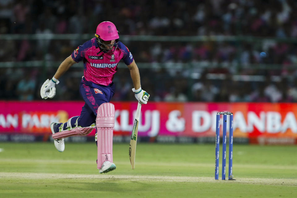 Rajasthan Royals’ Jos Buttler scores a run during the Indian Premier League cricket match between Lucknow Super Giants and Rajasthan Royals in Jaipur, India, Wednesday, April 19, 2023. (AP Photo Surjeet Yadav )