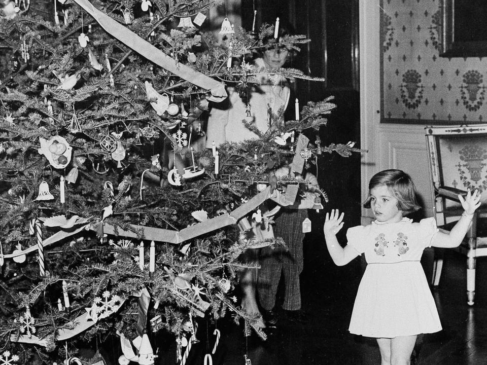 Caroline Kennedy looks at a White House Christmas tree in 1961.