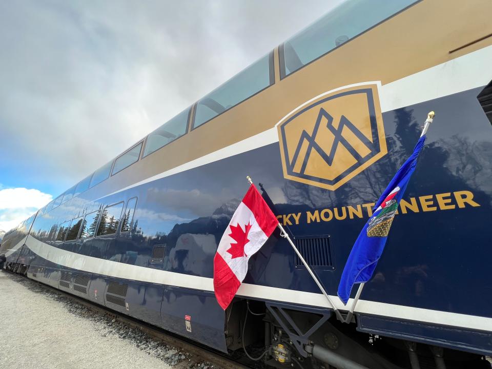 The Rocky Mountaineer train with a Canadian flag