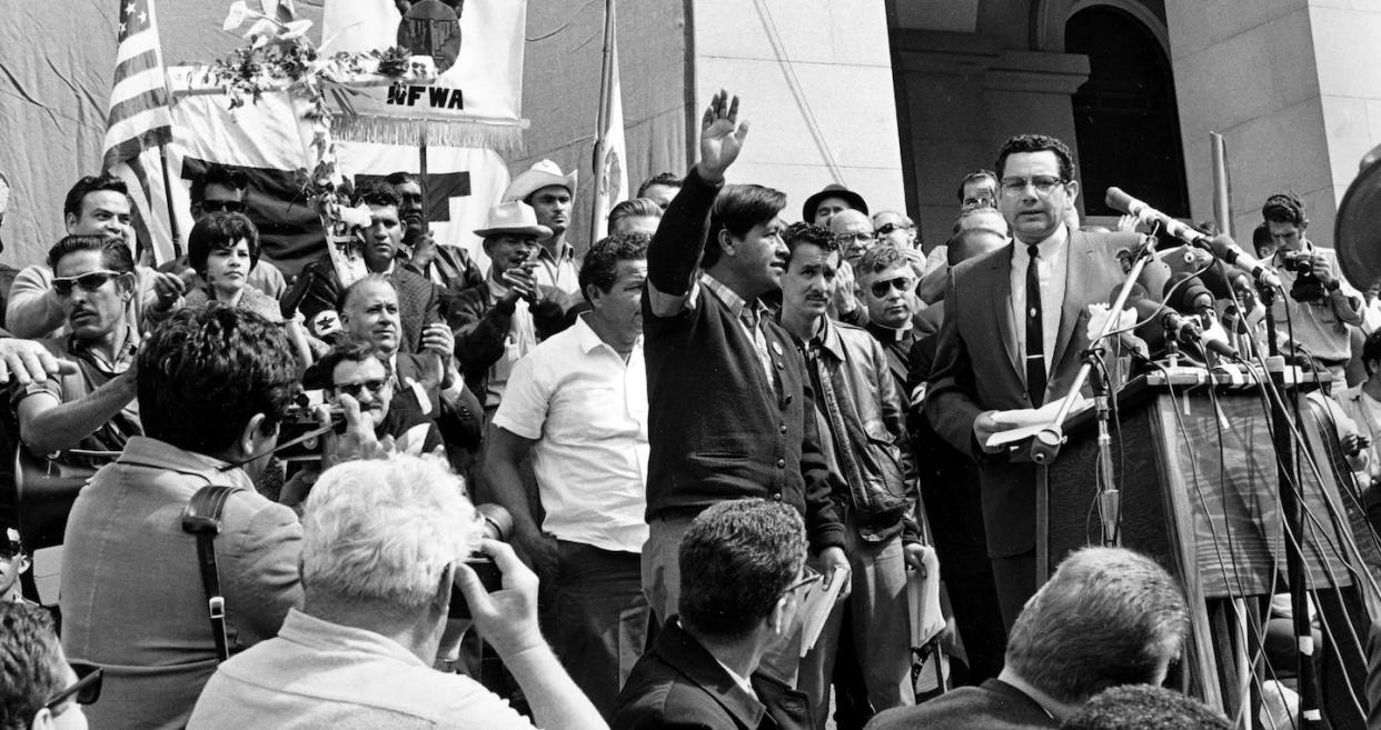 Cesar Chavez salutes the crowd on the steps of the California State Capitol. <a href="https://newsroom.ap.org/detail/CesarChavezFarmworkers/97021c0e28524a20b9bfbd53d785e05c/photo?Query=cesar%20chavez%20pilgrimage&mediaType=photo&sortBy=arrivaldatetime:desc&dateRange=Anytime&totalCount=2&currentItemNo=0" rel="nofollow noopener" target="_blank" data-ylk="slk:AP Photo;elm:context_link;itc:0;sec:content-canvas" class="link ">AP Photo</a>