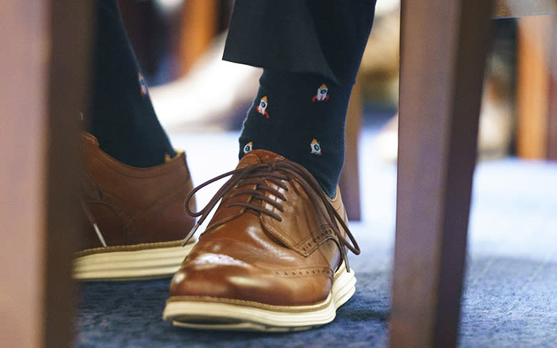 Spaceship socks are worn by Ryan Graves, Executive Director of Americans for Safe Aerospace, during a hearing