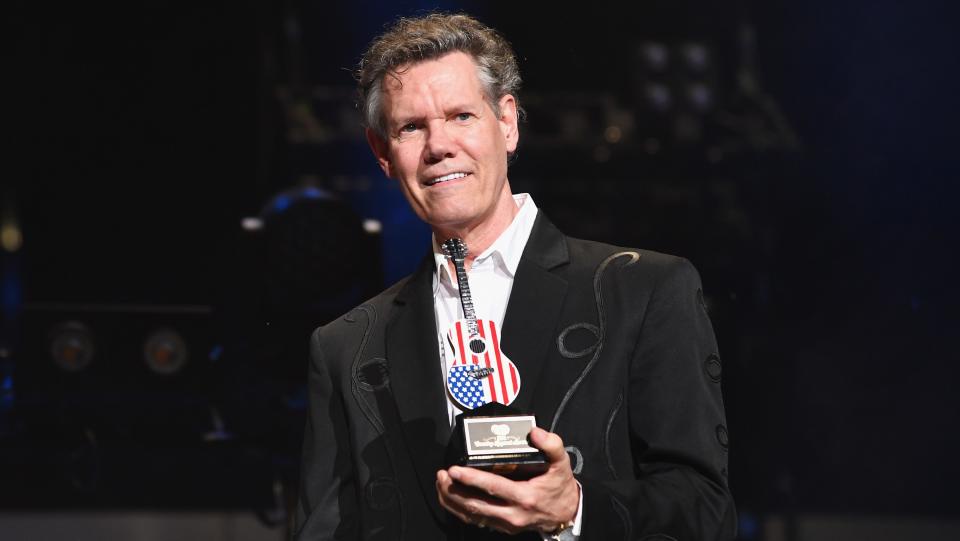 Randy Travis receives an award during the 2018 CMA Music Festival