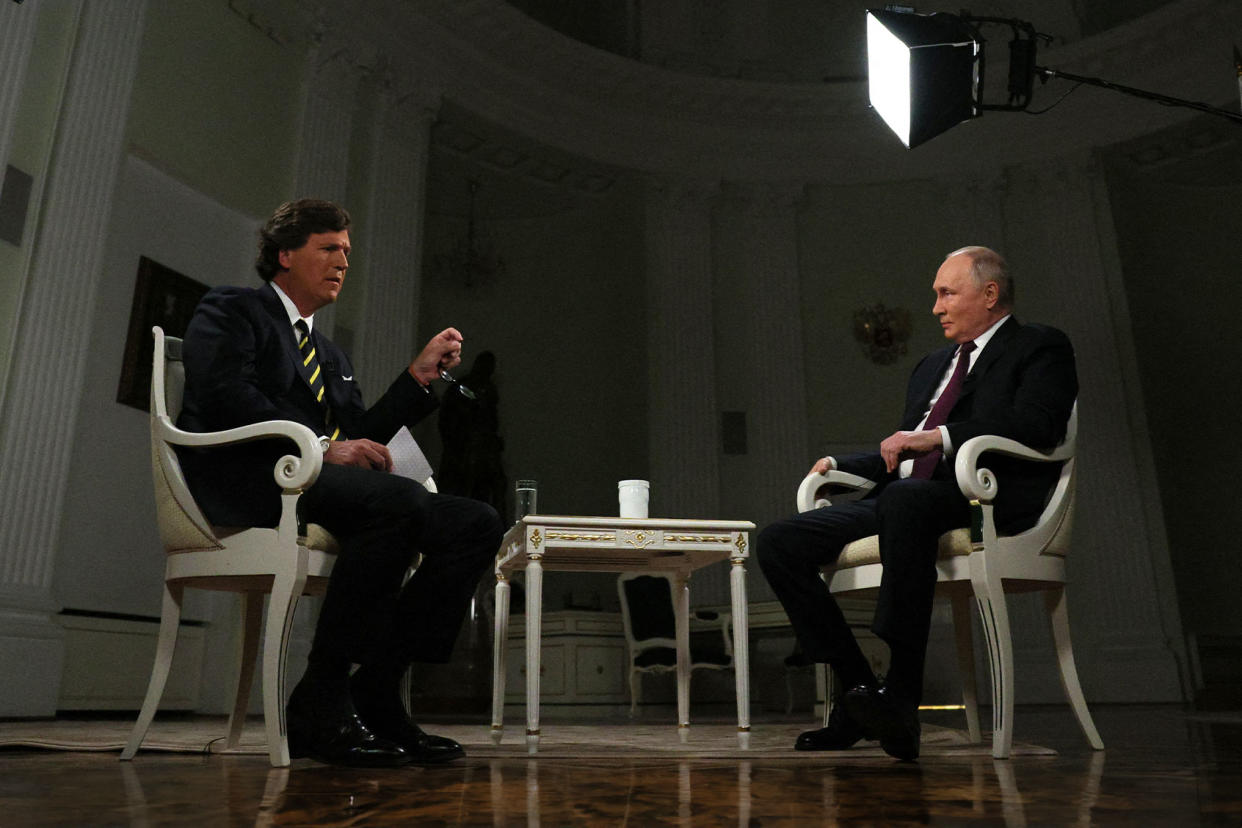 Tucker Carlson; Vladimir Putin GAVRIIL GRIGOROV/POOL/AFP via Getty Images