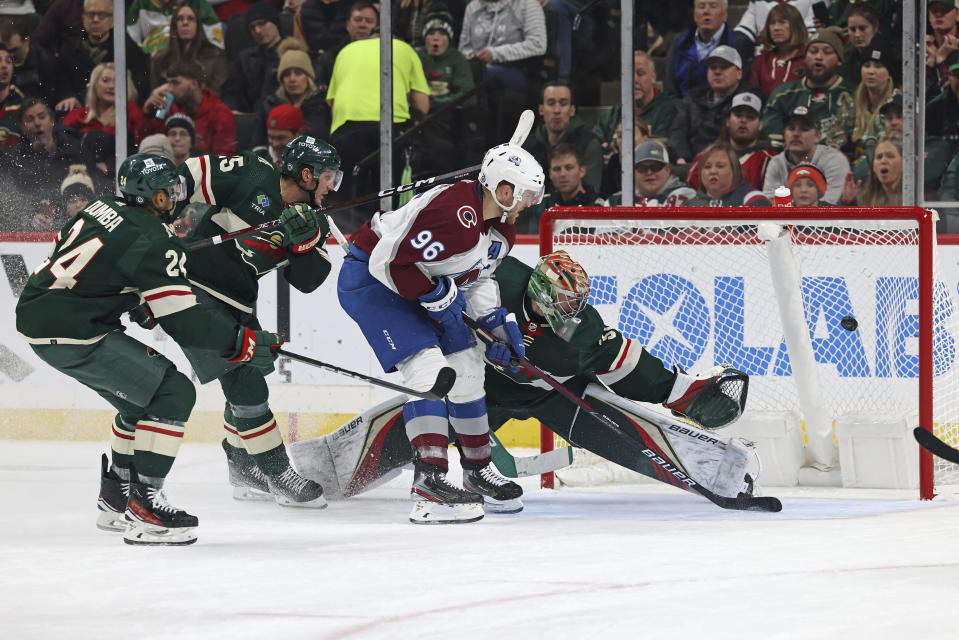 Colorado Avalanche right wing Mikko Rantanen (96) scores a goal against Minnesota Wild goaltender Filip Gustavsson, right, during the second period of an NHL hockey game Monday, Oct. 17, 2022, in St. Paul, Minn. (AP Photo/Stacy Bengs)