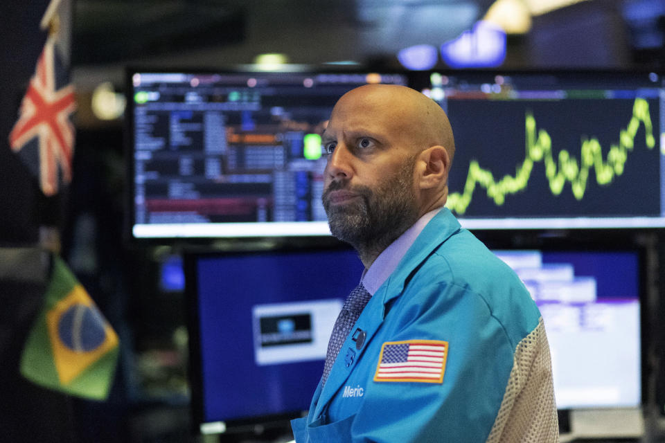 Stock trader Meric Greenbaum monitors stocks prior to the open of trading at the New York Stock Exchange, Wednesday, Sept. 18, 2019. The Federal Reserve is expected to announce its benchmark interest rate later in the day. (AP Photo/Mark Lennihan)