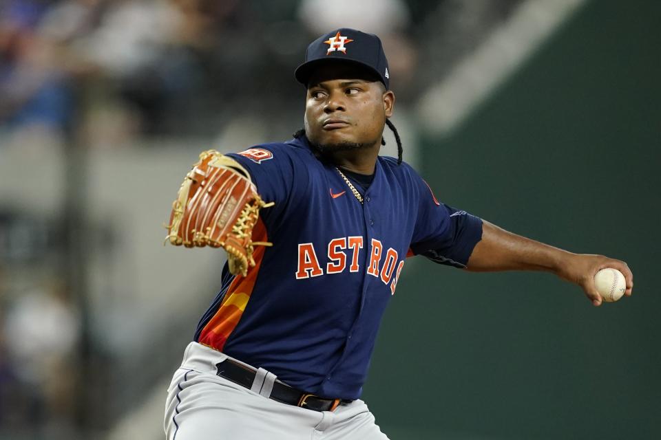 Houston Astros starting pitcher Framber Valdez throws to a Texas Rangers batter during the first inning of a baseball game in Arlington, Texas, Tuesday, Aug. 30, 2022. (AP Photo/Tony Gutierrez)