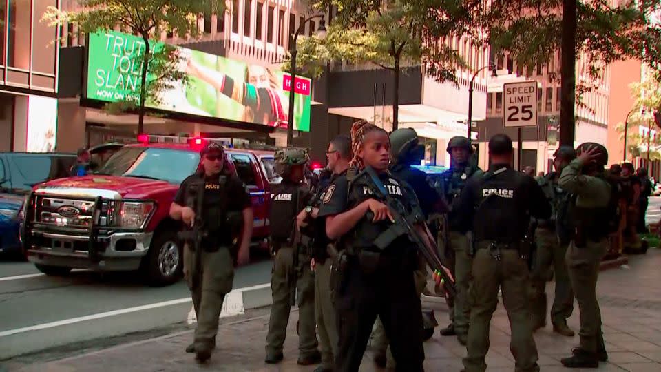 Law enforcement gathers near the scene of the reported shooting. - WANF