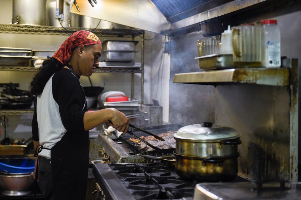 Thomas Kamae, Owner and Head Chef at Hawaiian Style BBQ, cooks at the restaurant on Friday, Nov. 11, 2022. Hawaiian Style BBQ is opening another location on Washington Road. 