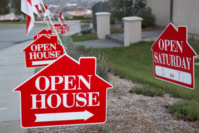 red and white open house sign...