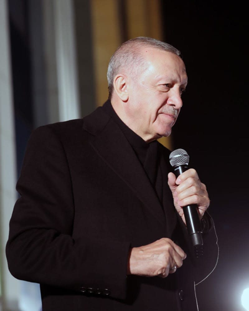 Turkish President and leader of Justice and Development (AK) party Recep Tayyip Erdogan addresses citizens from the balcony of the party's headquarters following the local elections. -/Turkish Presidency/dpa