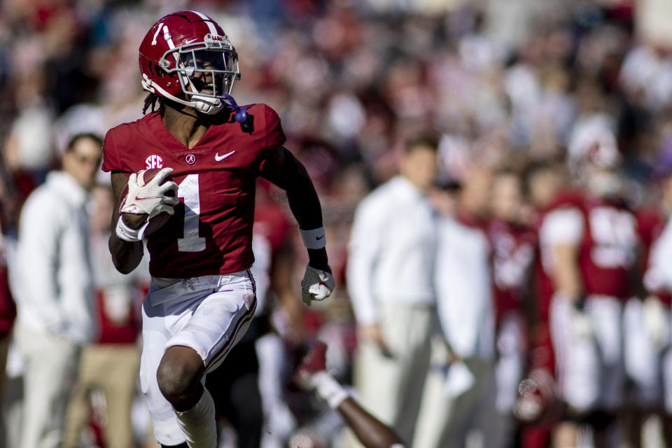 FILE - Alabama wide receiver Jameson Williams (1) runs down the sideline on a long pass reception against New Mexico State during the first half of an NCAA college football game Nov. 13, 2021, in Tuscaloosa, Ala. If the Chiefs want the closest player-for-player replacement for Tyreek Hill, it could mean trading up to pick Alabama's Jameson Williams, who is 10 weeks removed from an ACL injury. (AP Photo/Vasha Hunt, File)