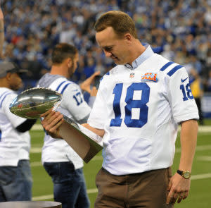 Nov 20, 2016; Indianapolis, IN, USA; Indianapolis Colts former quarterback Peyton Manning holds the Lombardi Trophy at halftime of a game against the Tennessee Titans to honor the 10th anniversary of the 2006 Super Bowl championship team at Lucas Oil Stadium. Mandatory Credit: Thomas J. Russo-USA TODAY Sports