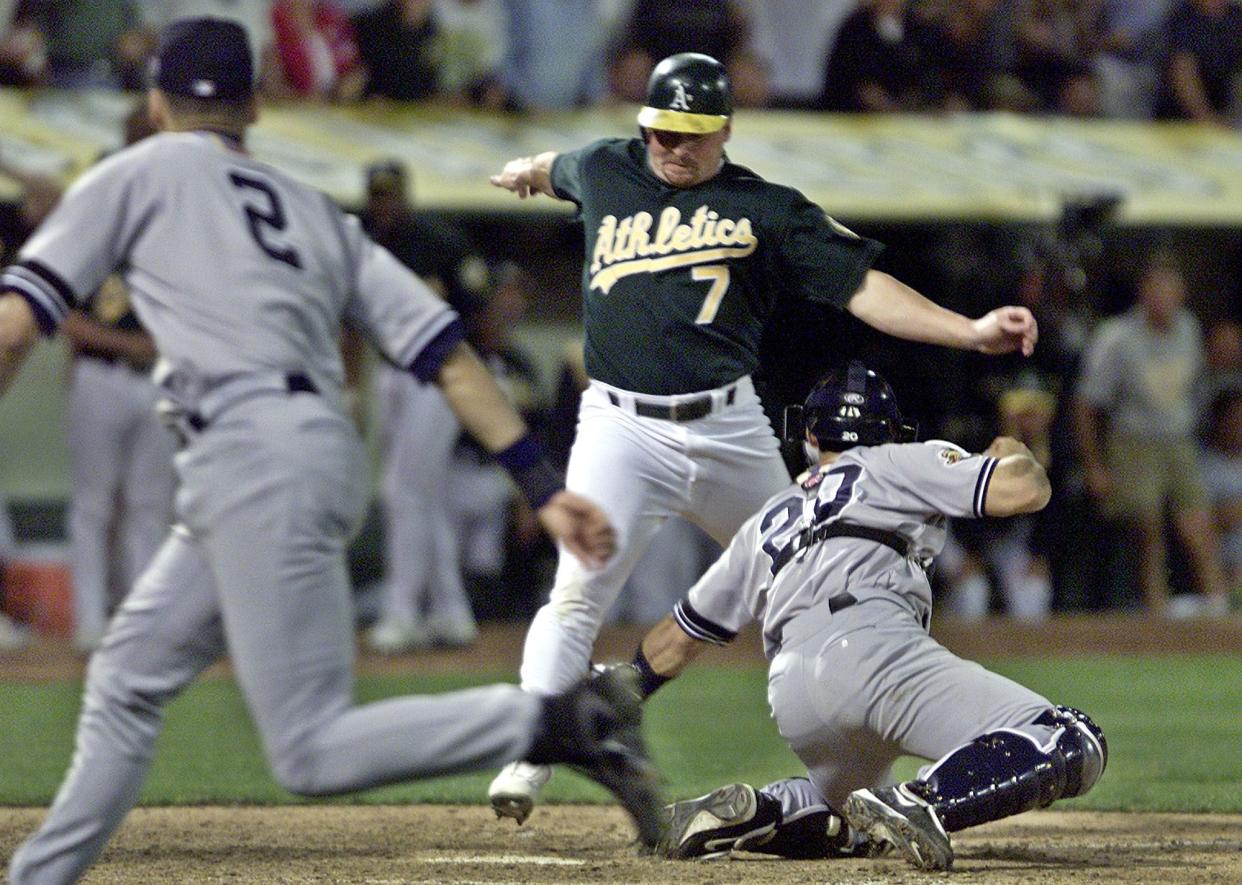 Jeremy Giambi is tagged out at home in Game 3 of the 2001 ALDS against the Yankees after Yankee shortstop Derek Jeter flipped the ball to catcher Jorge Posada.