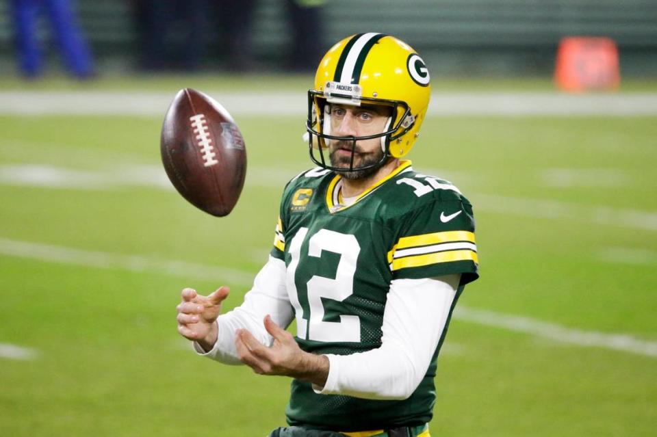 Green Bay Packers’ Aaron Rodgers warms up before an NFL football game against the Carolina Panthers Saturday, Dec. 19, 2020, in Green Bay, Wis. (AP Photo/Mike Roemer)