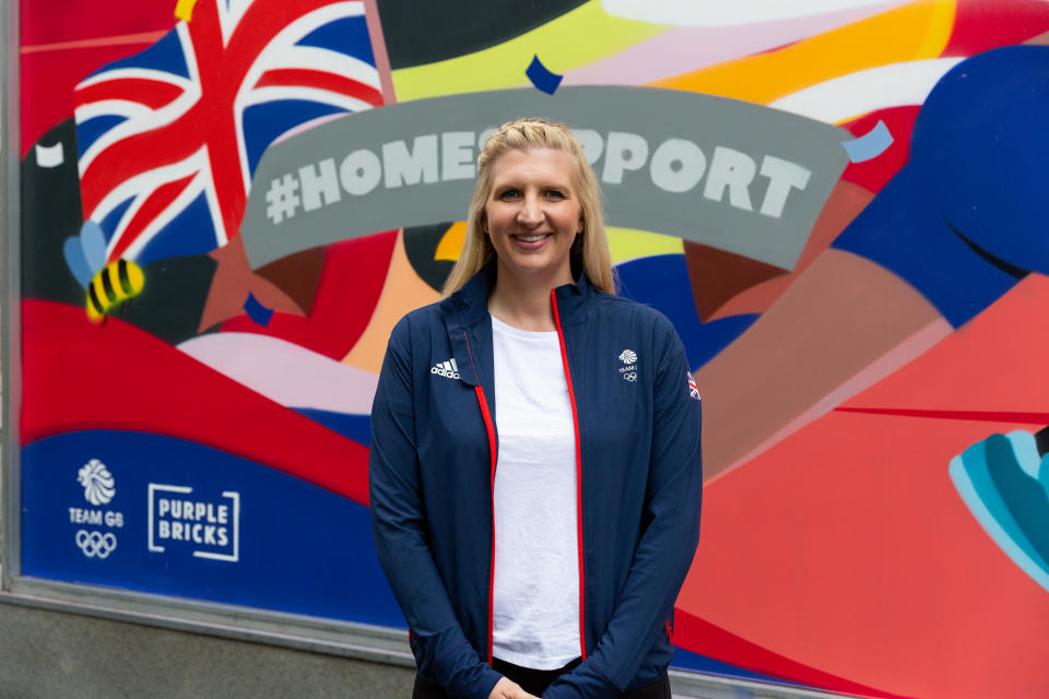 Rebecca Adlington poses in front of the mural in Manchester as part of the PurpleBricks Home Support campaign