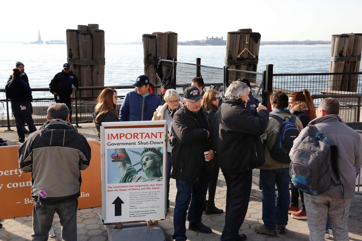 Tourists discover that the Statue of Liberty is closed Jan. 21, 2018, because of a federal government shutdown. The next day, New York state officials made money available to open the federal landmark.