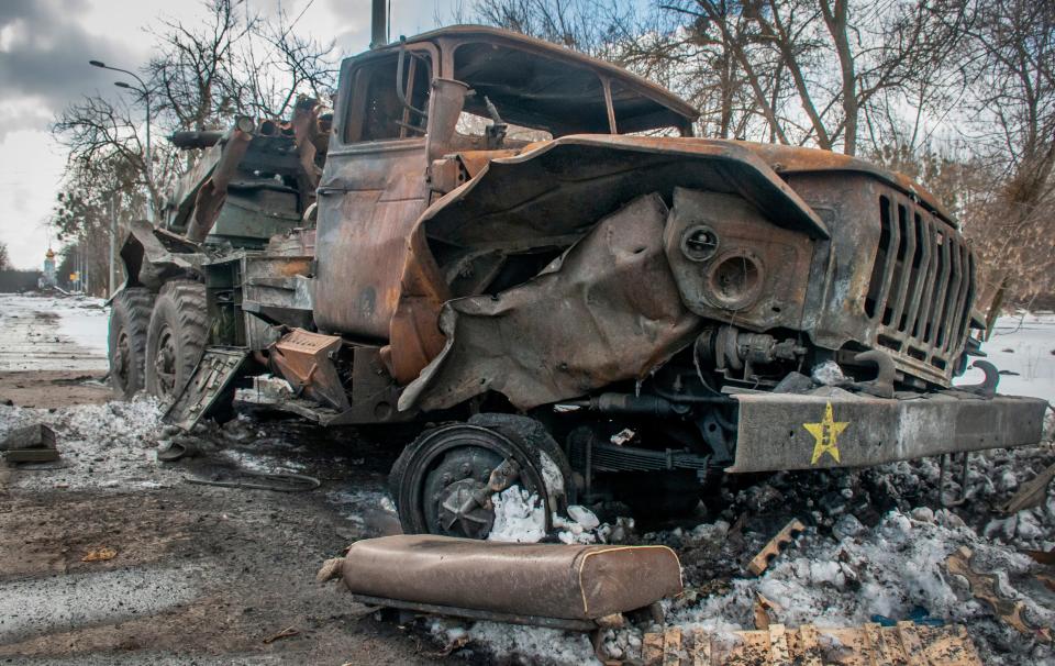 A damaged military vehicle sits in Kharkiv, Ukraine, Wednesday, March 16, 2022.