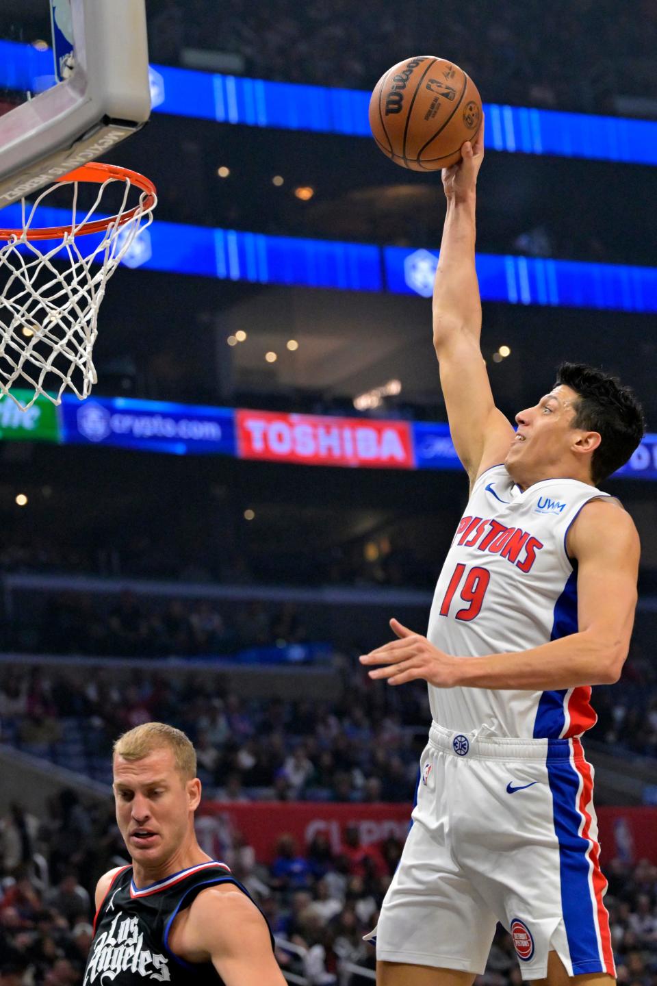 Detroit Pistons forward Simone Fontecchio scores past Los Angeles Clippers center Mason Plumlee in the first half at Crypto.com Arena in L.A., Feb. 10, 2024.