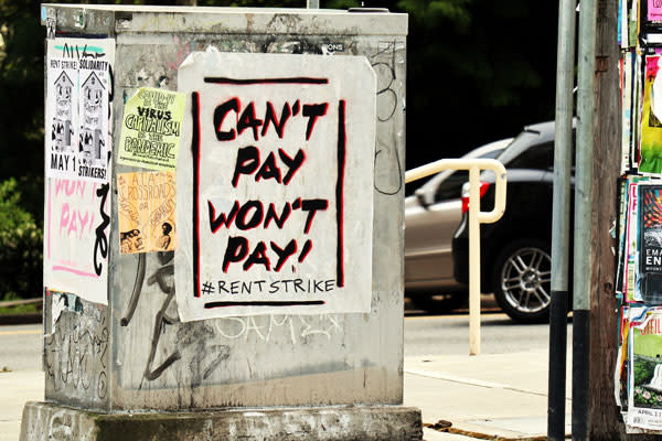 A utility box in Seattle's Capitol Hill neighbourhood is covered in graffiti and posters calling for a rent strike. Thousands of residential tenants in several American cities have pledged to stop paying rent in what has been described as the largest planned "rent strike" in the United States in decades.