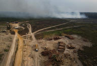 FILE - Smoke rises from a fire near a logging area in the Transamazonica highway region, in the municipality of Humaita, Amazonas state, Brazil, Sept. 17, 2022. Brazil has a major role to play in addressing climate change as home to the world's largest rainforest, but after the Sunday, Oct. 2, election, the subject is less likely to come up than ever. (AP Photo/Edmar Barros, File)