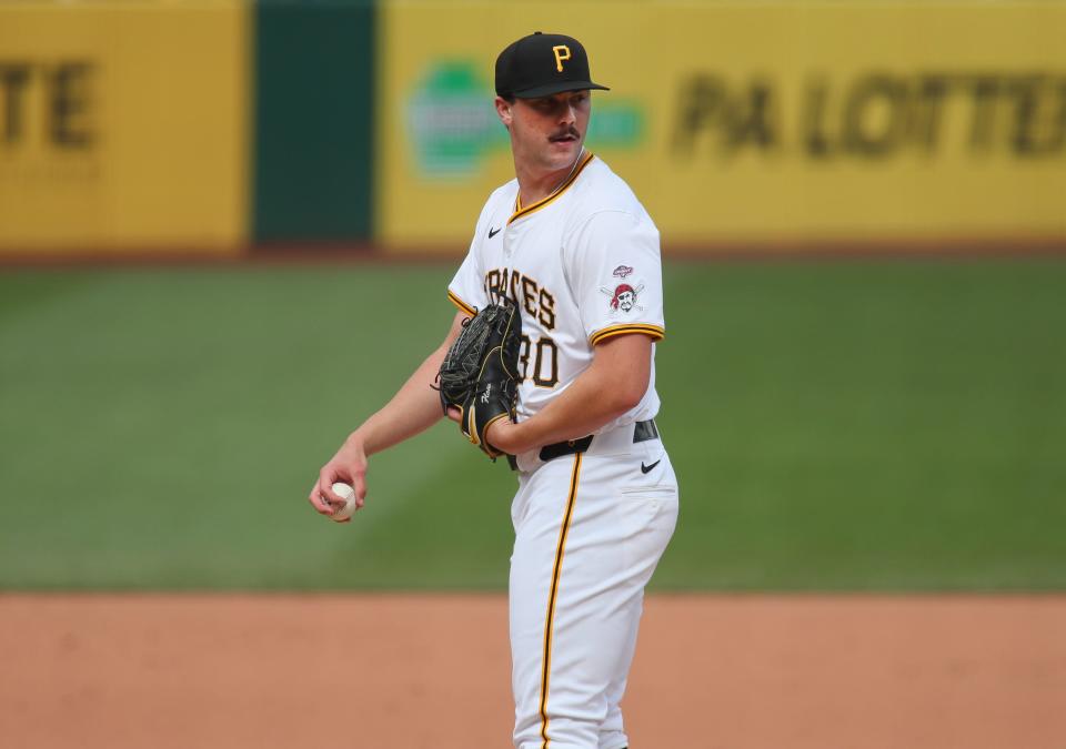 Pittsburgh Pirates pitcher Paul Skenes (30) eyes up the runner on first base during the second inning of his MLB Debut against the Chicago Cubs Saturday evening at PNC Park in Pittsburgh, PA.