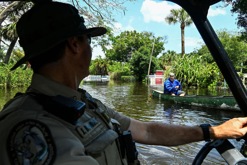 Lieutenant James Brodbeck of Florida Fish and Wildlife Conservation law enforcement patrols through the flooded neighborhood after heavy rain in Fort Lauderdale, Fla., on April 13, 2023.<span class="copyright">Chandan Khanna—AFP/Getty Images</span>