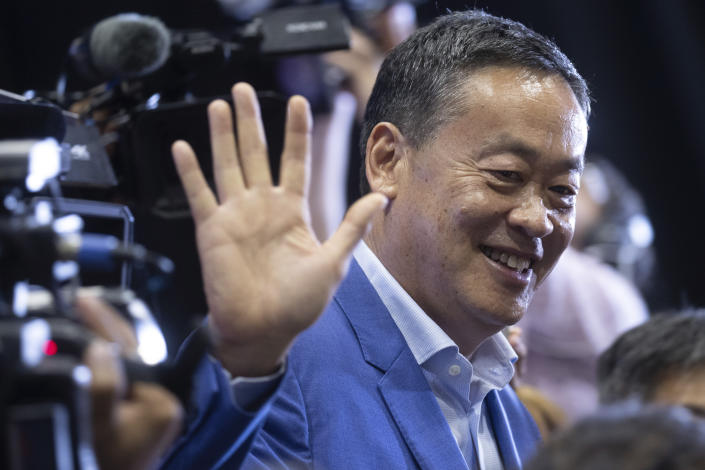 Pheu Thai Party's prime ministerial candidate Srettha Thavisin waves as he leaves after a press conference at Pheu Thai headquarter in Bangkok, Thailand, Sunday, May 14, 2023. Thailand's main opposition party took an early lead in a vote count from Sunday's general election, touted as a pivotal chance for change nine years after incumbent Prime Minister Prayuth Chan-ocha first came to power in a 2014 coup. (AP Photo/Wason Wanichakorn)