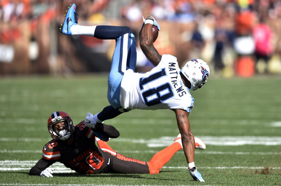 <p>Cleveland Browns strong safety Briean Boddy-Calhoun (20) up-ends Tennessee Titans wide receiver Rishard Matthews (18) in the first half of an NFL football game, Sunday, Oct. 22, 2017, in Cleveland. (AP Photo/David Richard) </p>