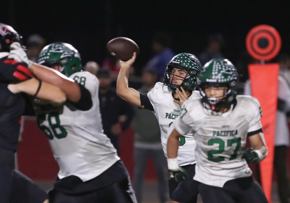 Pacifica quarterback Dominic Duran fires a pass against Rio Mesa during Tritons' 28-3 win on Oct. 20.