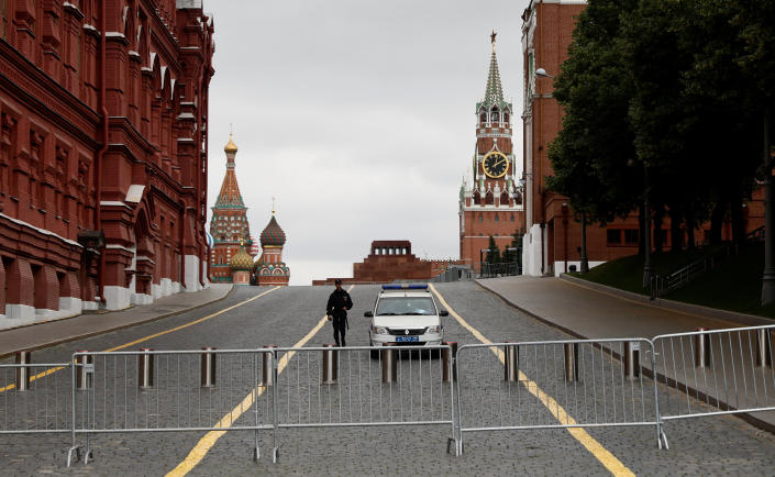 A Russian police officer guards the closed Red Square in Moscow on Saturday. (Maxim Shemetov/Reuters)
