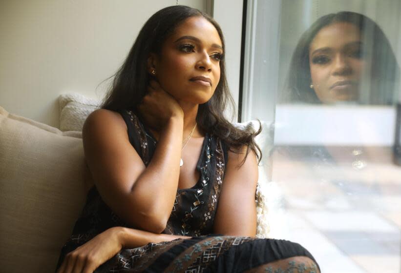 WEST HOLLYWOOD, CA - OCTOBER 10, 2023 - Jeanell English and her dog Duke at her home in West Hollywood on October 10, 2023, English, the former film academy diversity, equity and inclusion executive, was part of a wave of Hollywood DEI departures earlier this year. (Genaro Molina / Los Angeles Times)