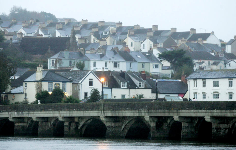 FILE PICTURE - Bideford, Devon.  A Devon town famously referred to as the "Little White Town" has agreed to change signposts to alter it's nickname after complaints were made to a councillor.  See SWNS story SWBRwhite.  Bideford in North Devon takes it's "Little White Town" moniker from Charles Kingsley's  book Westward Ho! which was written in 1855 and set in and around the area.  However, it seems there are some people who want to consign what they see as a politically incorrect tag to history.  Bideford town councillor and former mayor Dermot McGeough tables a motion at last night's town council meeting which called to scrap the name from signs in the town.  